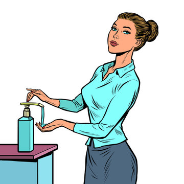 a woman uses a hand sanitizer