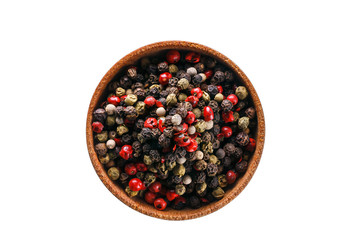 Close up shot of brown pot with aromatic dry spices. Set of pink, black, white and green pepper. Fragrant flavouring and seasonings for food. WHite isolated background.