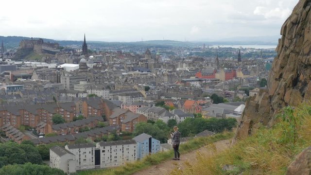 Girl Taking Pictures From Mountain Of Scotland