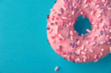 one pink donut in minimal on blue background