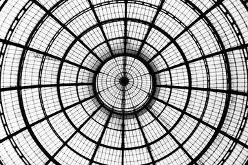 Look up at glass dome in the Galleria Vittorio Emanuele II in Milan. Geometric detail.