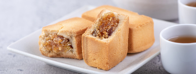 Pineapple cake pastry - Taiwanese famous sweet delicious dessert food with tea, close up, copy space design.