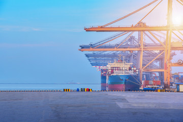Cargo Containers mooring in port during lifting goods box, containers ship berthing port