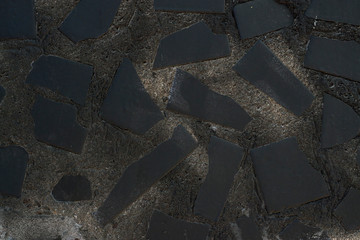 Stone Concrete Wall with Black Marble Inserts Background Texture