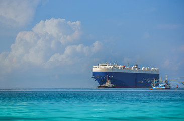 Ship sailing in the sea, logistics and transportation of international, ship in ocean at blue sky,...