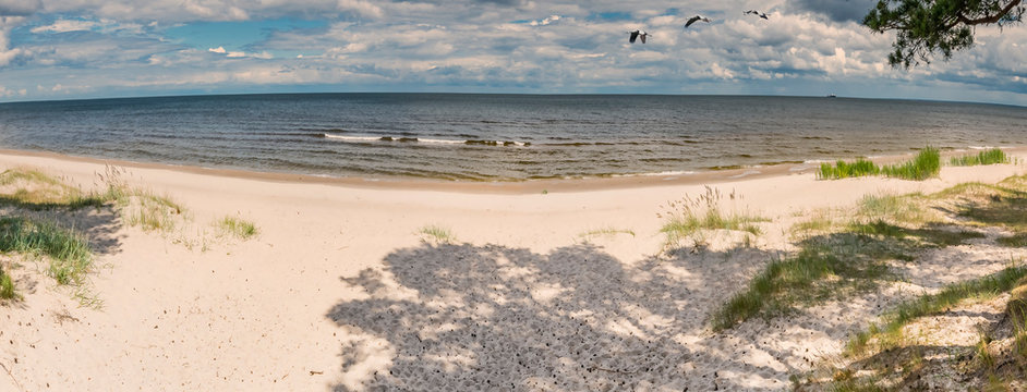 Panoramic view on sandy beach of the Baltic Sea. Spherical image composition for romantic inspiration and happy travel and tourist vacation concept
