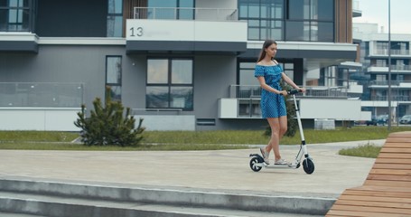 woman riding on electric kick scooter