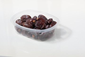 Dried dates fruits on white background, tasted sweet and chewy