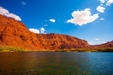 Wide river and tall green grass.