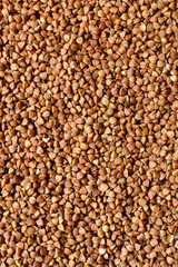 The texture of buckwheat. Raw buckwheat closeup. Top view