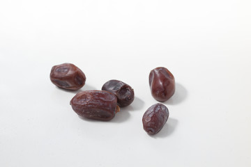 Dried dates fruits on white background, tasted sweet and chewy