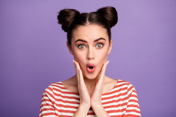 Closeup photo of crazy pretty lady teen two cute buns open mouth listen amazing good news arms on cheeks wear white red casual striped shirt isolated purple pastel color background