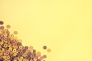 Breakfast with Colorful cereals and yellow background
