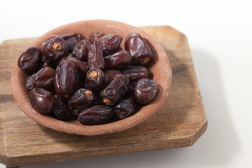 Dried dates fruits on white background, tasted sweet and chewy