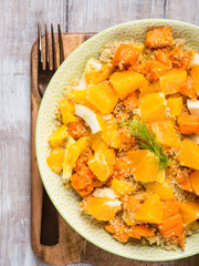 Fresh summer vegan quinoa bowl salad with baked spiced pumpkin, fennel, oranges and turmeric. Healthy gluten free lunch or dinner