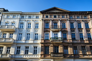 Fototapeta na wymiar Facades with balconies of historic tenement houses in the city of Poznan..