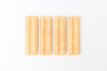 Wafer with white chocolate on white background