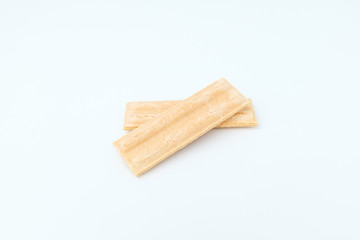 Wafer with white chocolate on white background