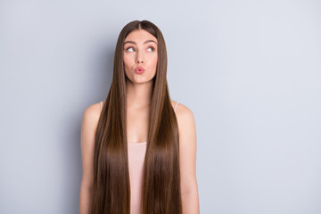 Photo of pretty charming wondered lady ideal neat long hairstyle look empty space interested pouted...