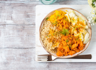 Vegan quinoa bowl with baked spiced pumpkin, fennel, bell pepper and turmeric. Healthy gluten free lunch or dinner