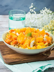 Fresh summer vegan quinoa bowl salad with baked spiced pumpkin, fennel, oranges and turmeric. Healthy gluten free lunch or dinner