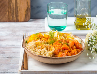 Vegan quinoa bowl with baked spiced pumpkin, fennel, bell pepper and turmeric. Healthy gluten free lunch or dinner