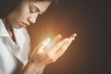 Naklejka premium Woman hands praying for blessing from god. Praying hands with faith in religion and belief in God on blessing background.