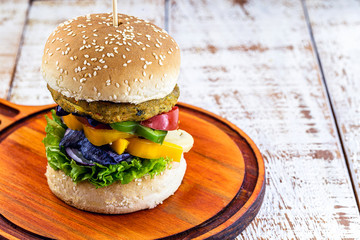 Vegetarian burger, Sandwich made without meat. It can be made from corn, potatoes, textured soy protein, legumes, tofu, mushrooms or cereals.