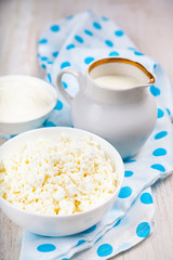 Dairy products on a wooden table.