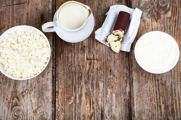 Dairy products on a wooden table.