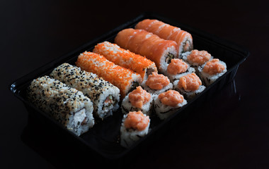 A lot of delicious rolls from a Japanese restaurant. Range of beautiful food. Advertizing foot photo