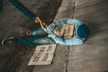 Begging under the bridge with the message I need home.