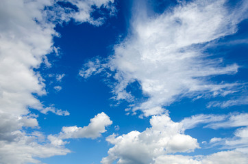 White clouds against a blue sky.