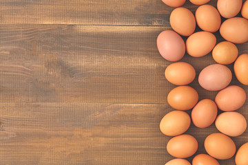 many fresh chicken brown eggs top view with copy space