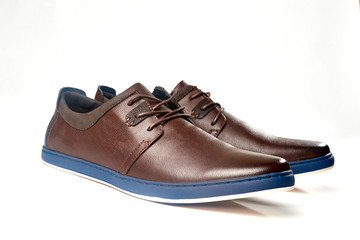 Men fashion brown shoe leather over white background. Pair casual stylish footwear.