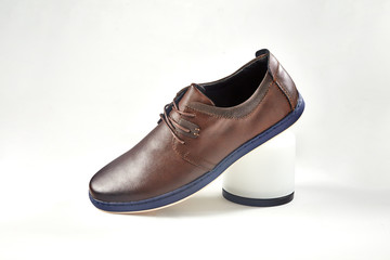 Men fashion brown shoe leather over white background. Pair casual stylish footwear.