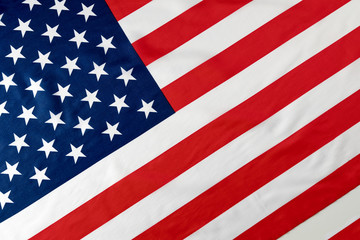 Close up of ruffled American flag. Satin texture curved flag of USA. Memorial Day or 4th of July....