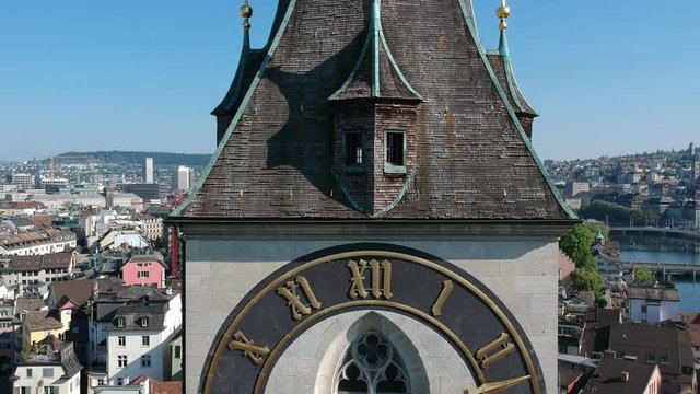 Zurich with close up of the Church of St. Peter and Europe's largest tower clock face with the time of 9:13 in the morning.