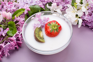 A bowl of milk and fresh fruit salad. Healthy food with vitamins.