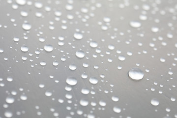 Background design made of water drops on a gray background	