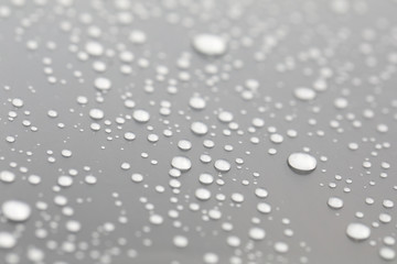 Background design made of water drops on a gray background	