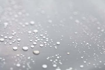 Background design made of water drops on a gray background	