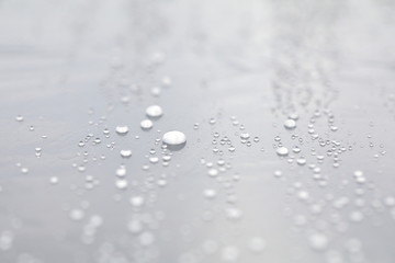 Background design made of water drops on a gray background	