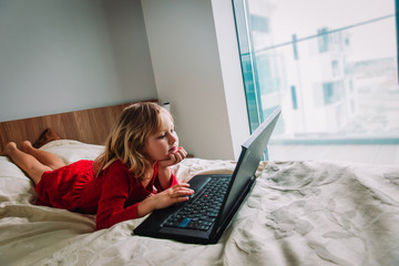 little girl learning remotely at home, online education for kids