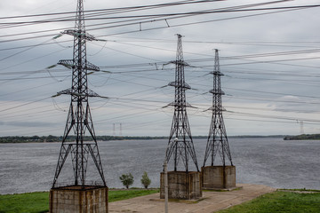 high voltage line on the banks of a wide river