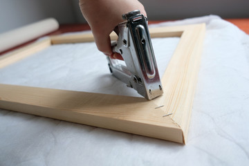 close up of hands working on a wooden board