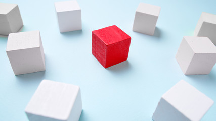 Wooden cubes blue background, business concept