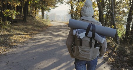 Active healthy hipster woman hiking in forest