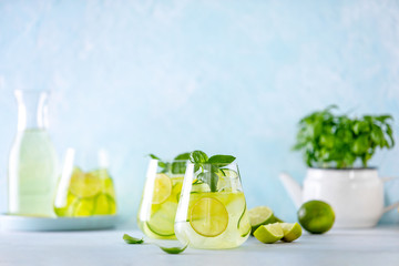 Cucumber and basil gin and tonic cocktail in glasses - obrazy, fototapety, plakaty