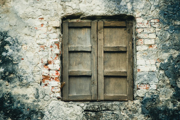 old wooden window on a vintage wall close-up